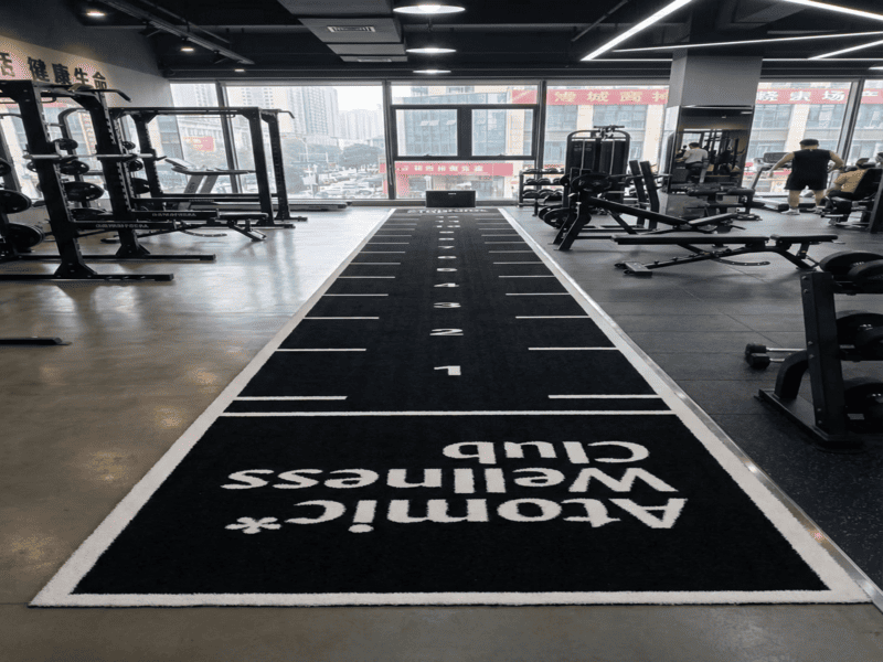 brushing gym turf to redistribute infill